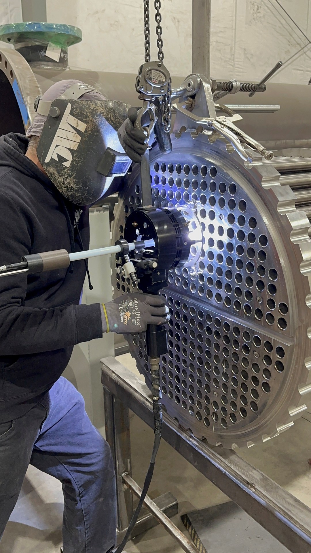 Certified welder performing precision welding on a tubesheet at Inland Mechanical, Richland WA